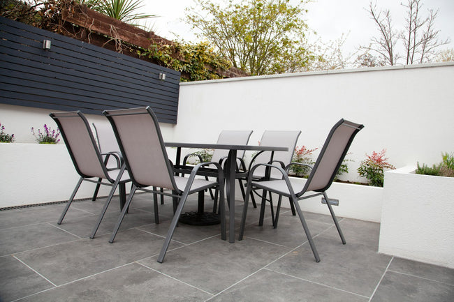 Outdoor dining table set on a patio - category image